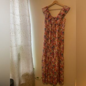 Colorful floral dress with band at the back which ties into a bow.
